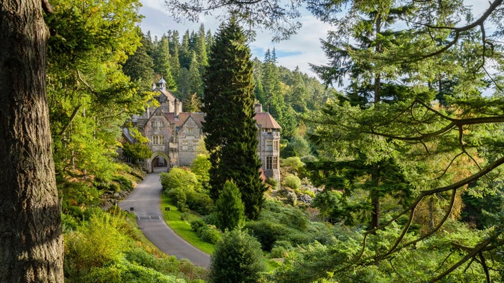 A family walking through the Rock Garden at Cragside